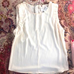 White sleeveless blouse